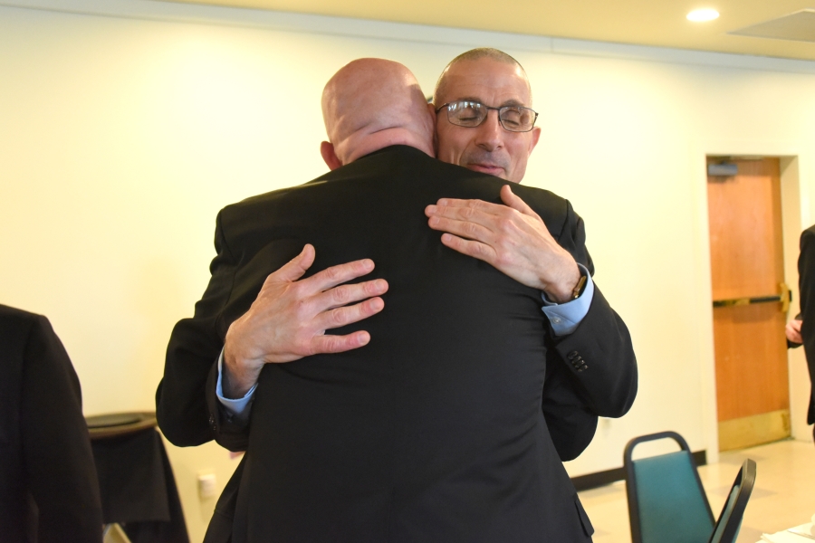 Bishop-elect James Ruggieri receives a congratulatory hug.