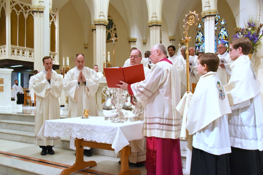 Bishop Deeley consecrates the oil of sacred chrism.