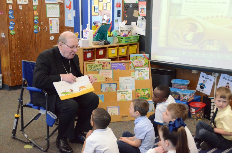Bishop reading to students 