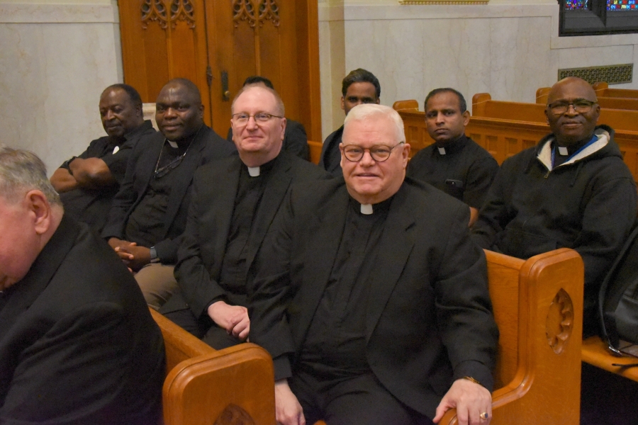 Msgr. Andrew Dubois and Father Claude Gendreau with other priests.