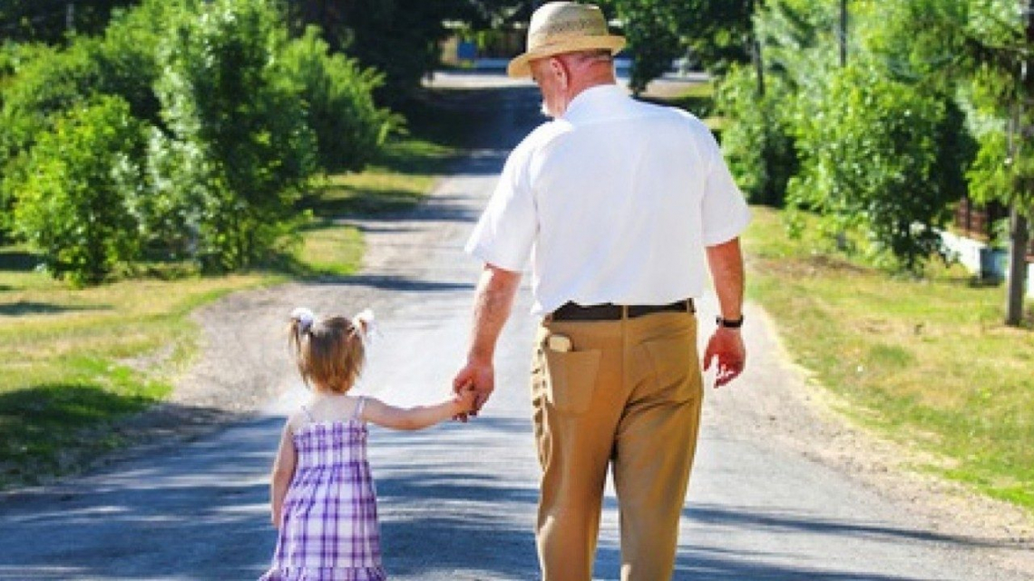 grandfather and child walking