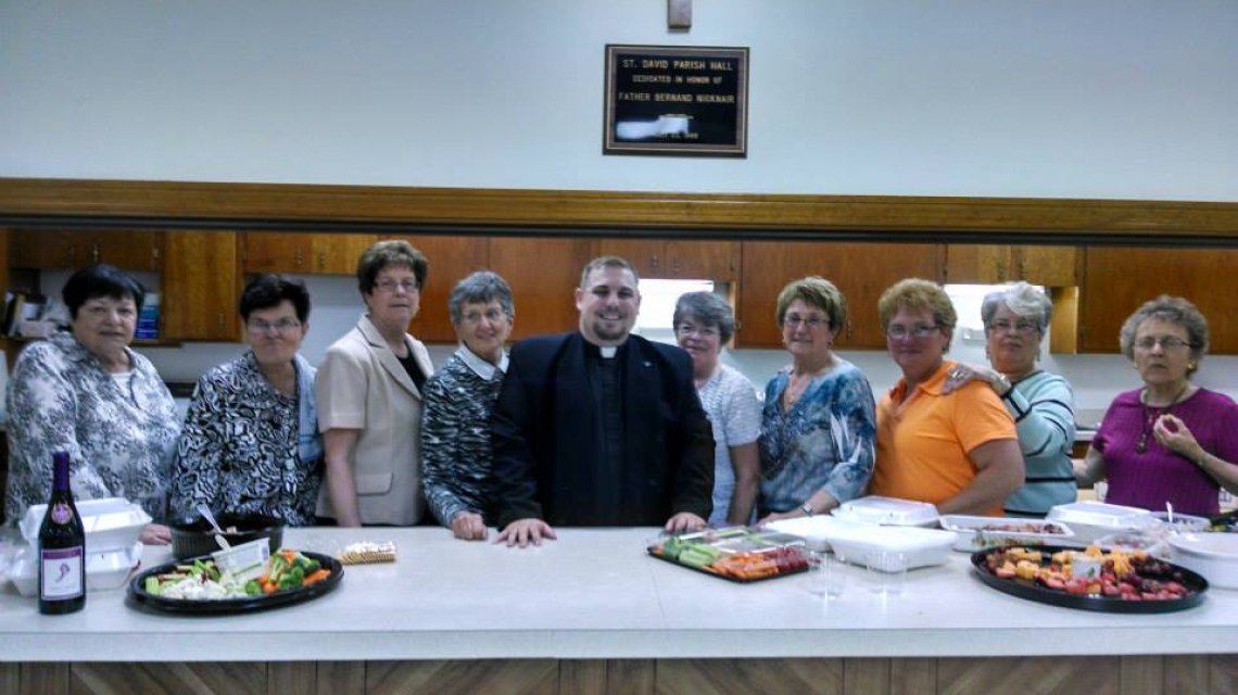 Priest among volunteers