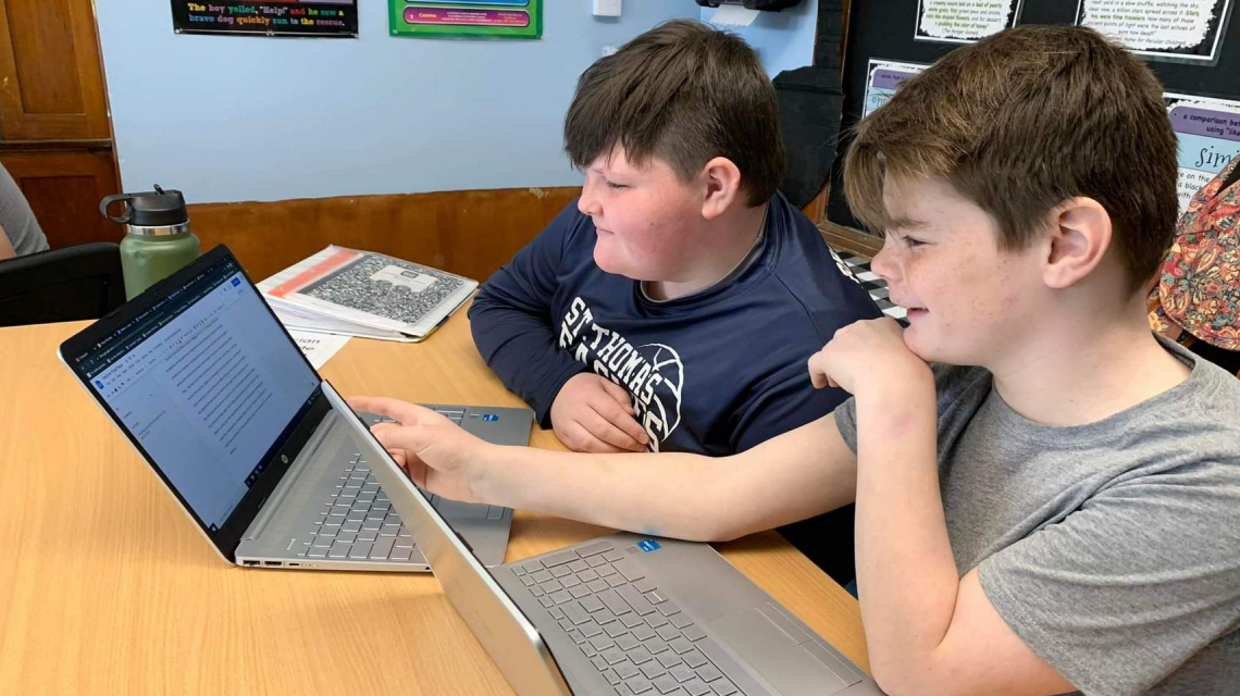 Two boys at a computer