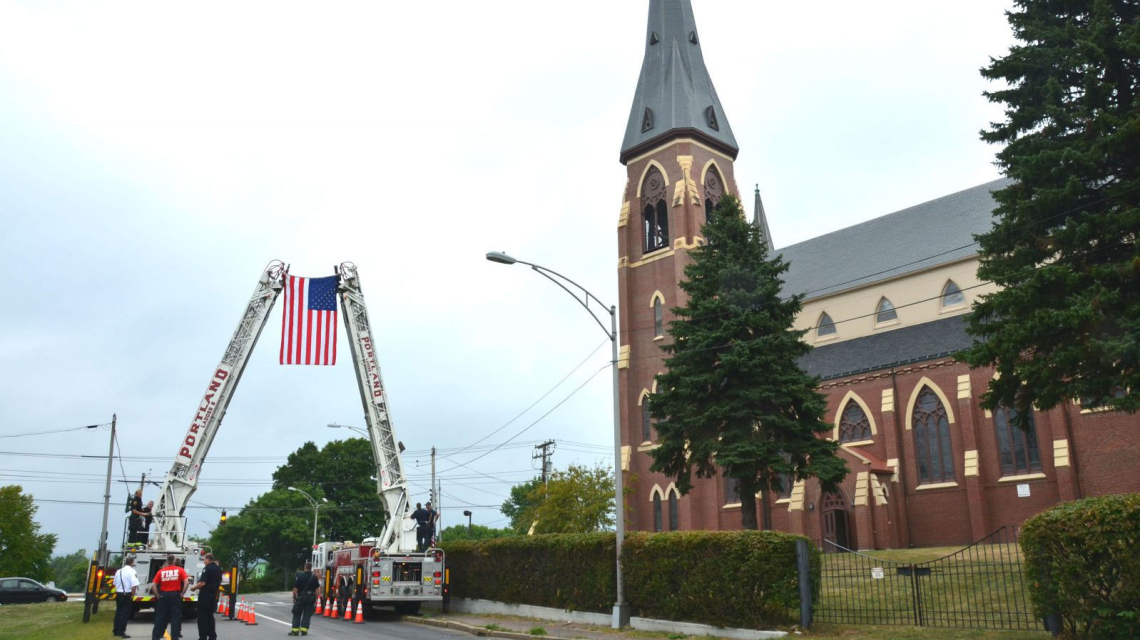 Fire trucks with flag outside the Cathedral for the 2016 Blue Mass