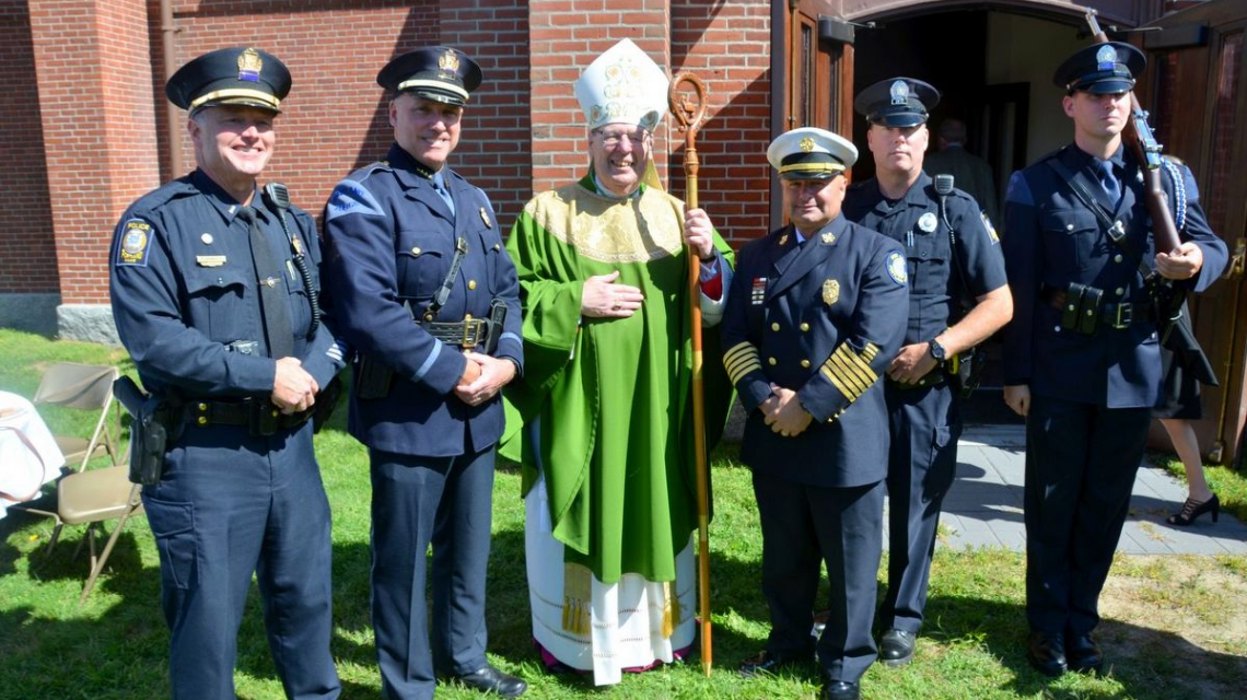 Blue Mass - Bishop outside cathedral with first responders