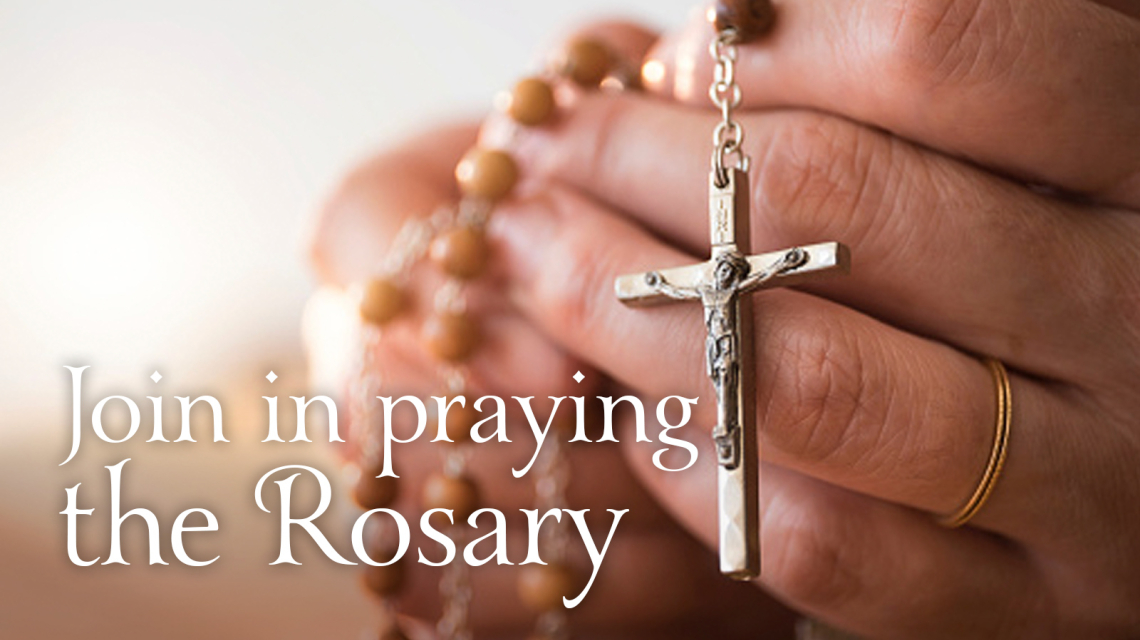 Hands with rosary beads