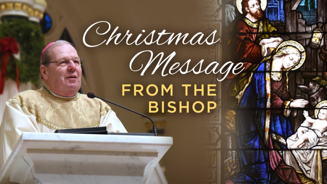 Bishop at altar with words Christmas Message from Bishop Deeley