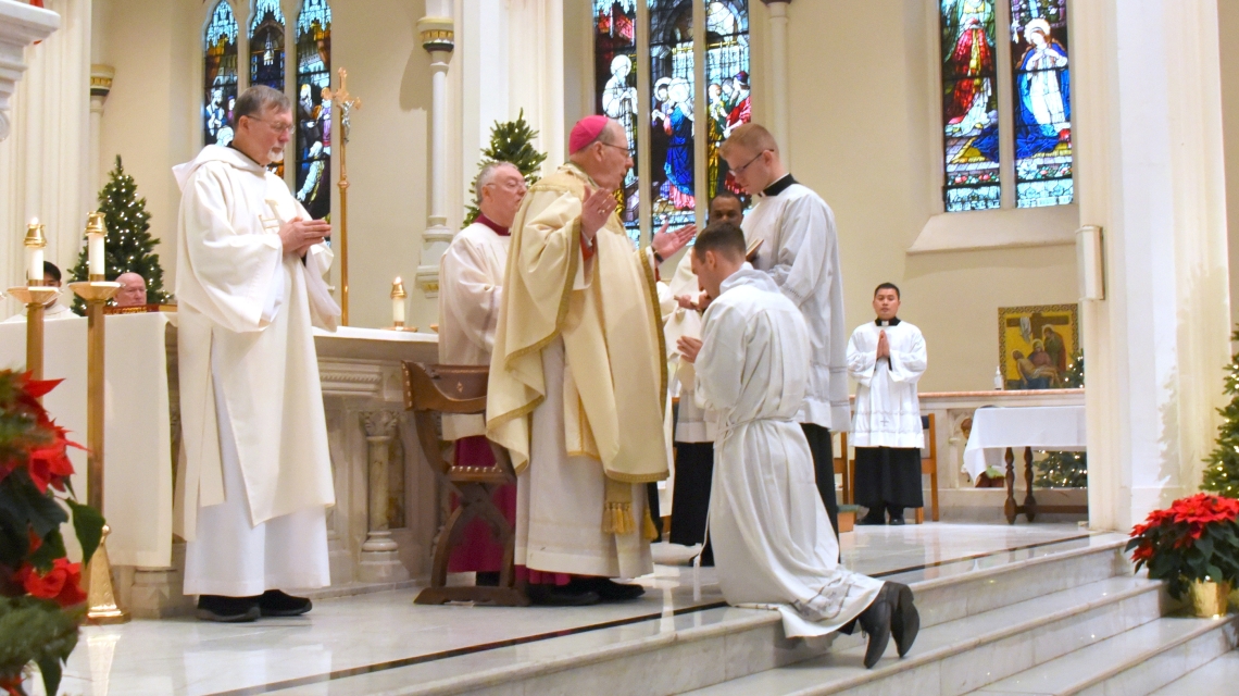 Bishop Deeley prays the Prayer of Ordination