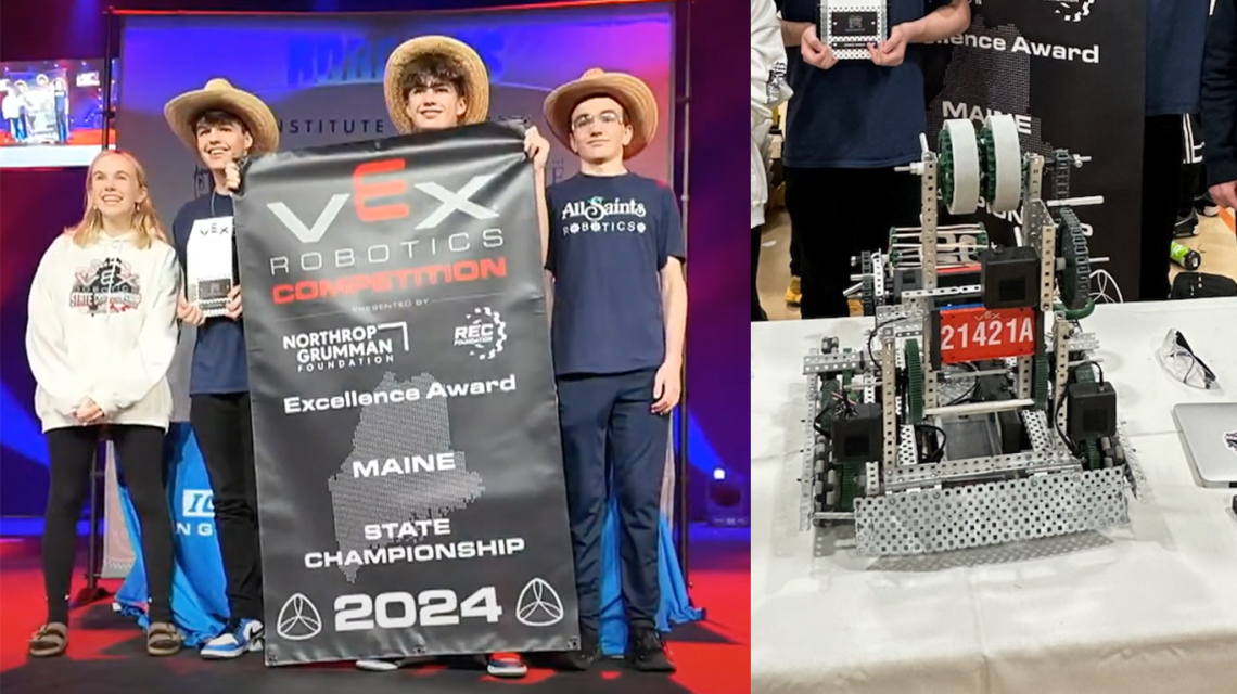 Students with banner and winning robot