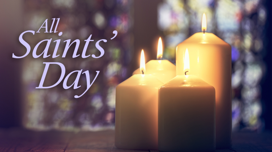 Candles with the words All Saints' Day