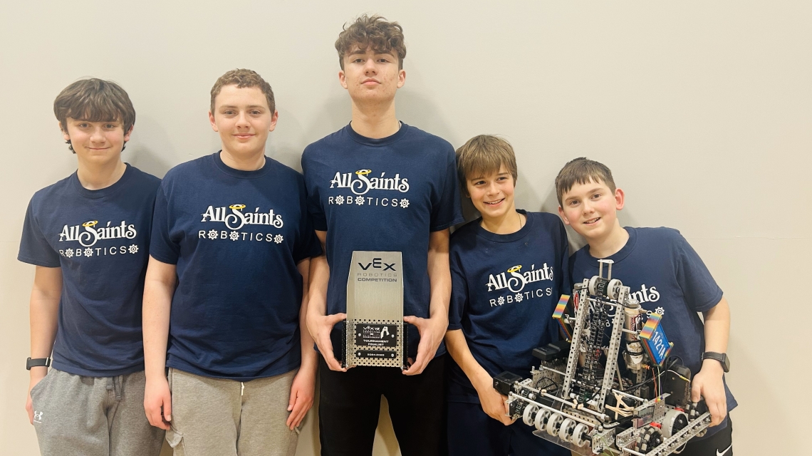 Team Blitz posing with their robot.