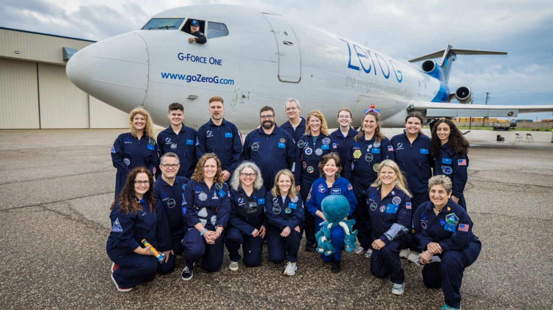 Pictured in front of G-Force One are the 8 teachers in the Embedded Teacher Program, with Space for Teachers mentors, NASA STEM Enhancement in Earth Science (SEES) interns, Zero-G pilot, Marcos Valdez, and Astronaut Cady Coleman