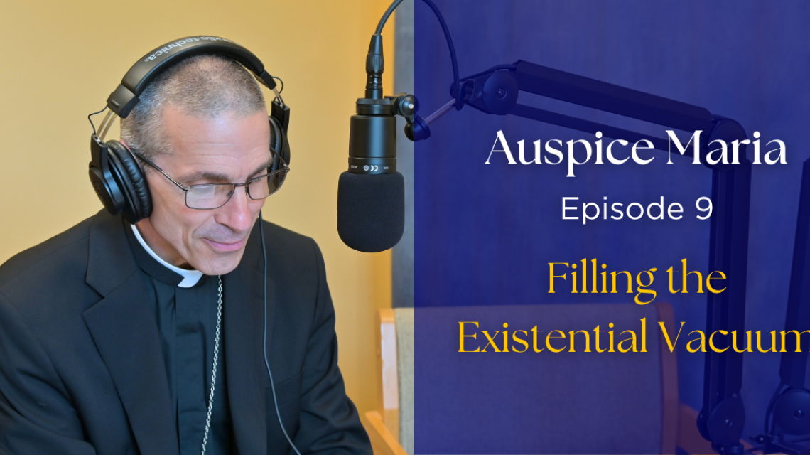 Bishop Ruggieri sitting in front of a microphone. text: "Auspice Maria, Episode 9 filling the existential vacuum"