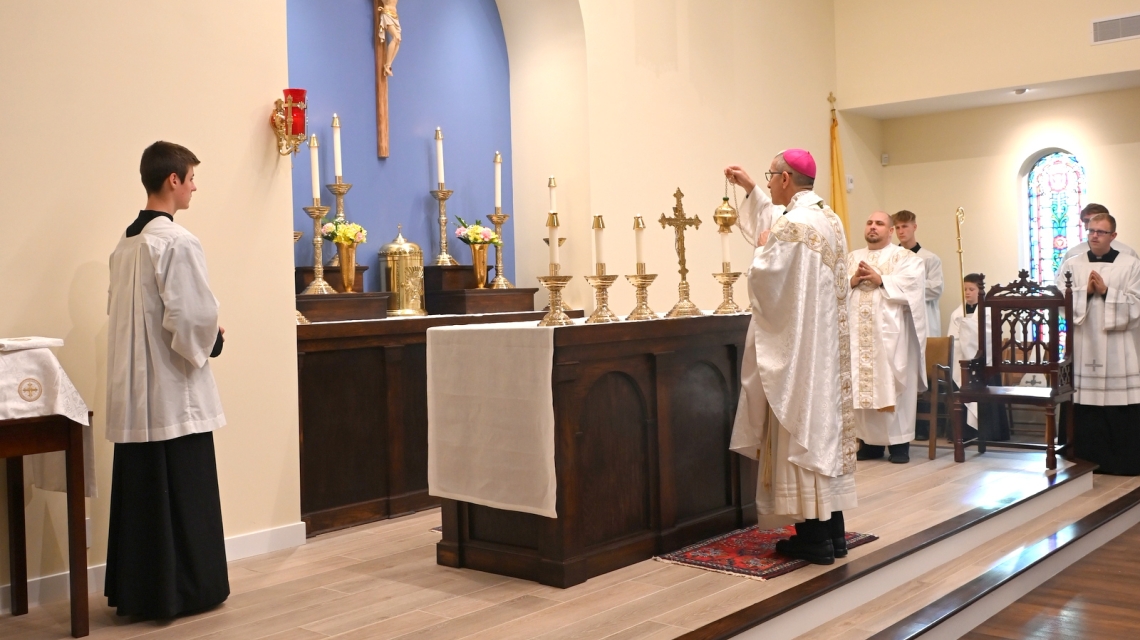 Bishop Ruggieri incenses the altar.