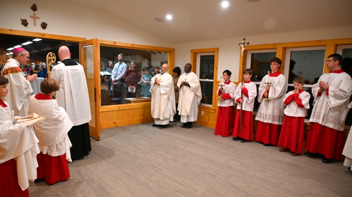 Priests and altar servers gathered in the narthex for the blessing.