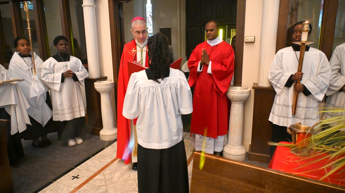 Bishop Ruggieri blesses palms at the beginning of the Mass.
