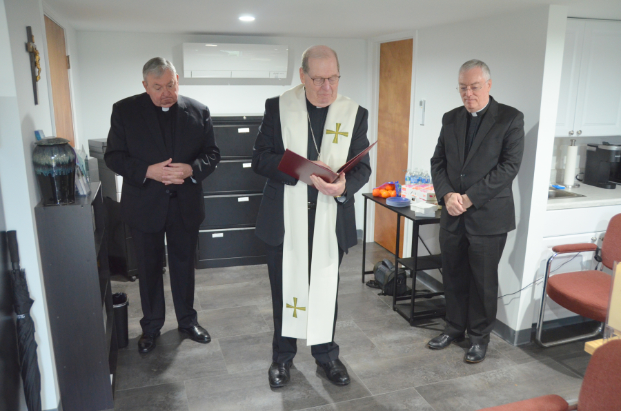 Bishop Deeley blesses the new office at St. Joseph Cemetery in Biddeford. 