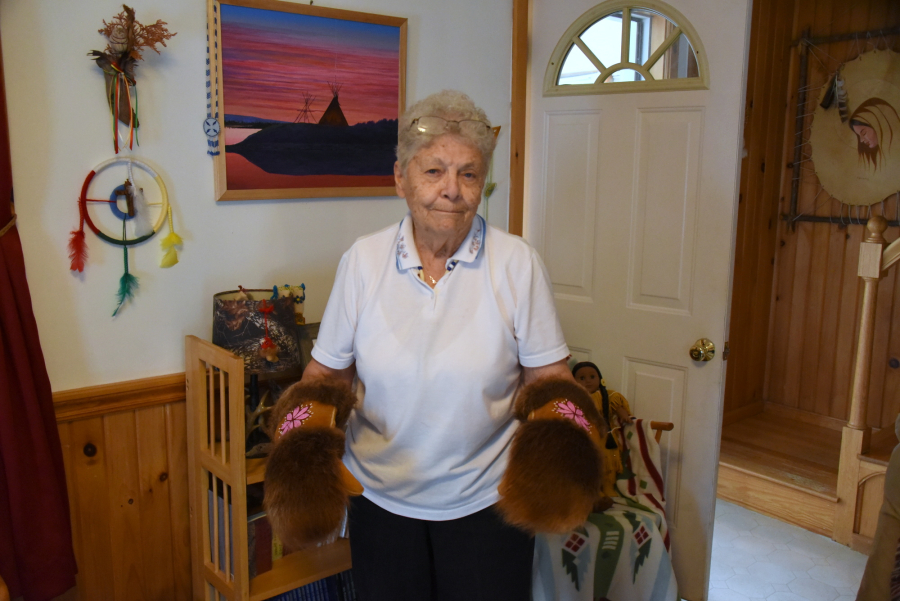 Sister Bernadette Gautreau wearing dogsledding mittens.
