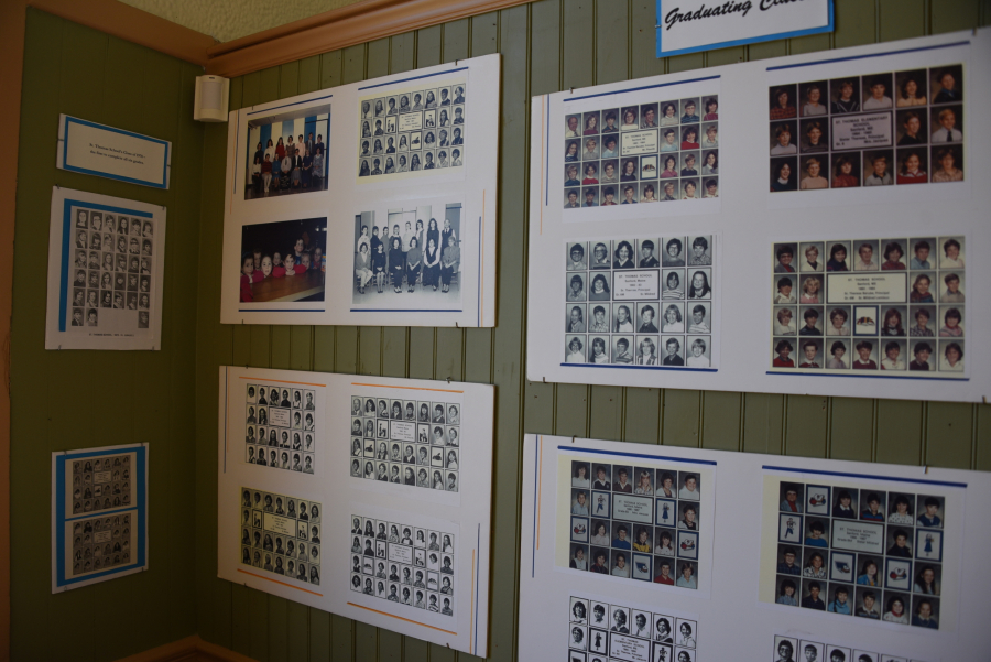 Museum display of old photos from St. Thomas School