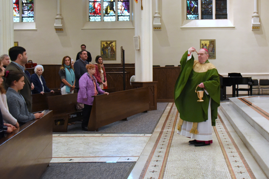 Bishop Deeley blesses the congregation