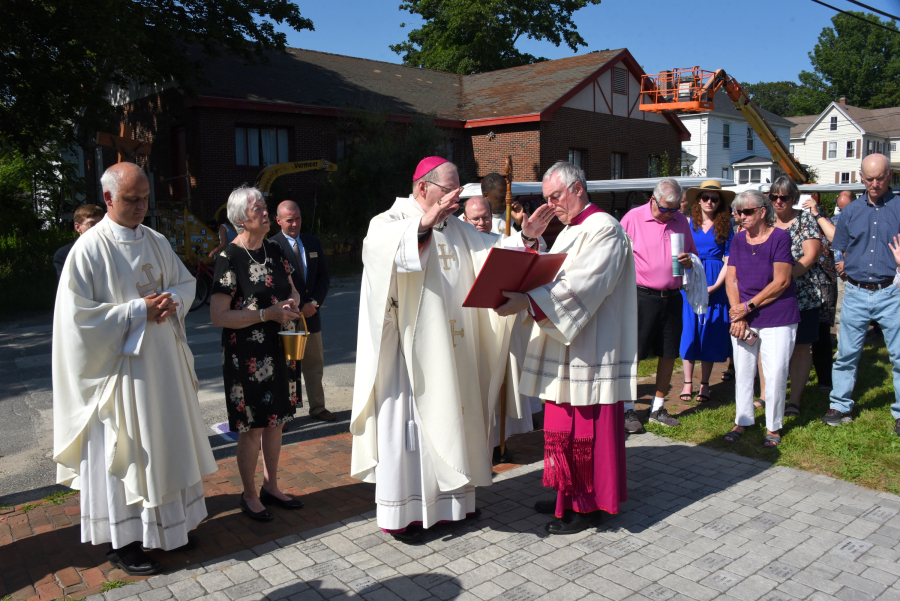 Bishop Robert Deeley blesses the pavers