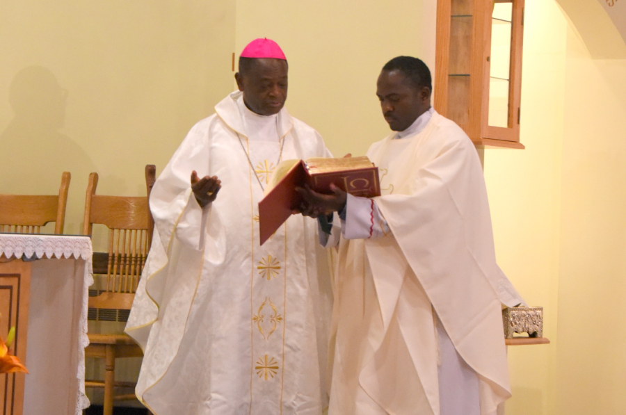 Bishop George Nkuo prays