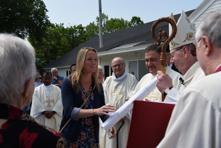 Patricia O'Brien shares remarks with the bishop.