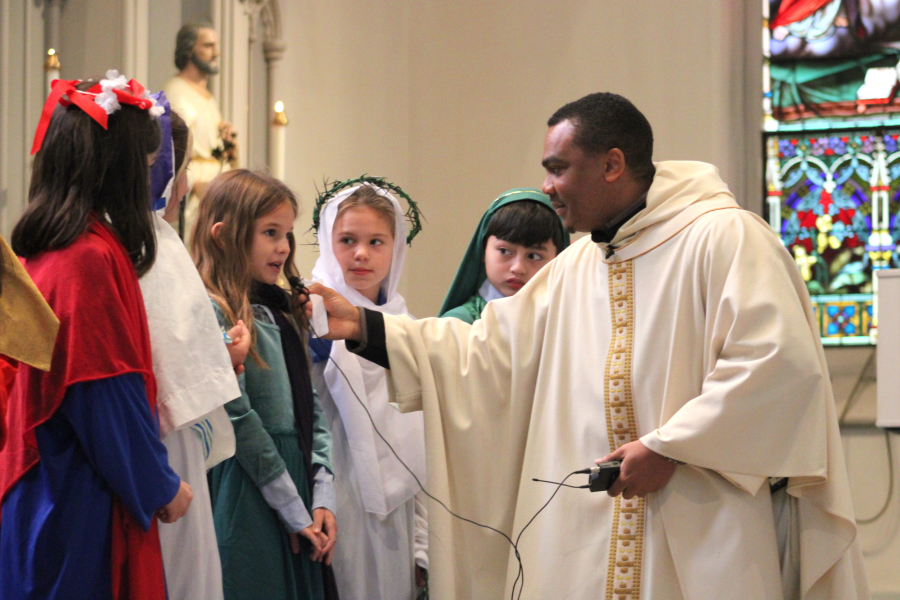 Father Joseph Osunde with the third graders