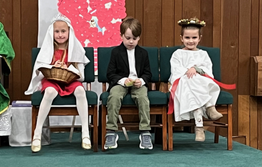 Three children dressed as saints