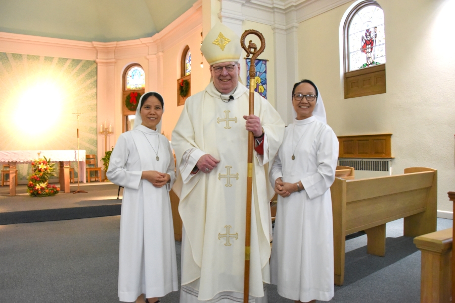 Bishop Robert Deeley poses with Sister Guiliana and Sister Kim.