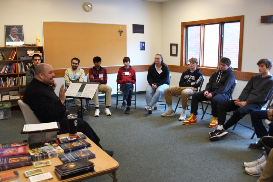 Teens listen to Fr. Brad Morin