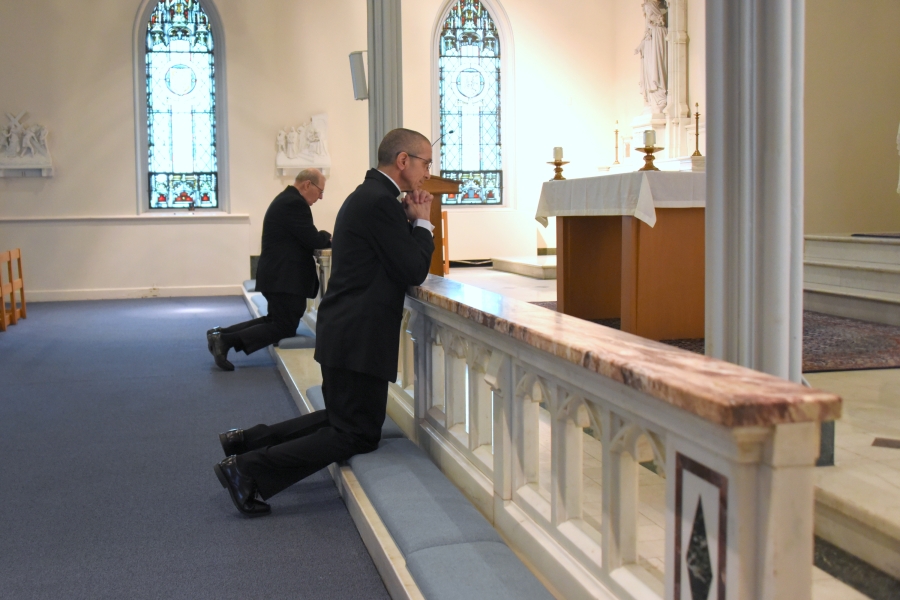 Bishop-Elect James Ruggieri and Bishop Deeley pray in the cathedral chapel.
