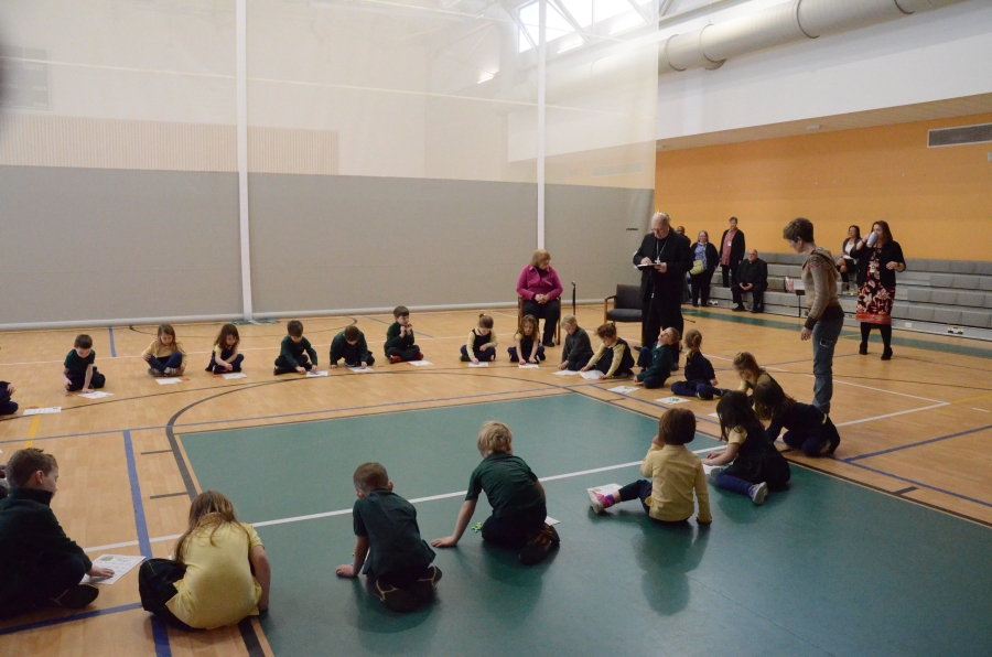 Students in a circle in a gym