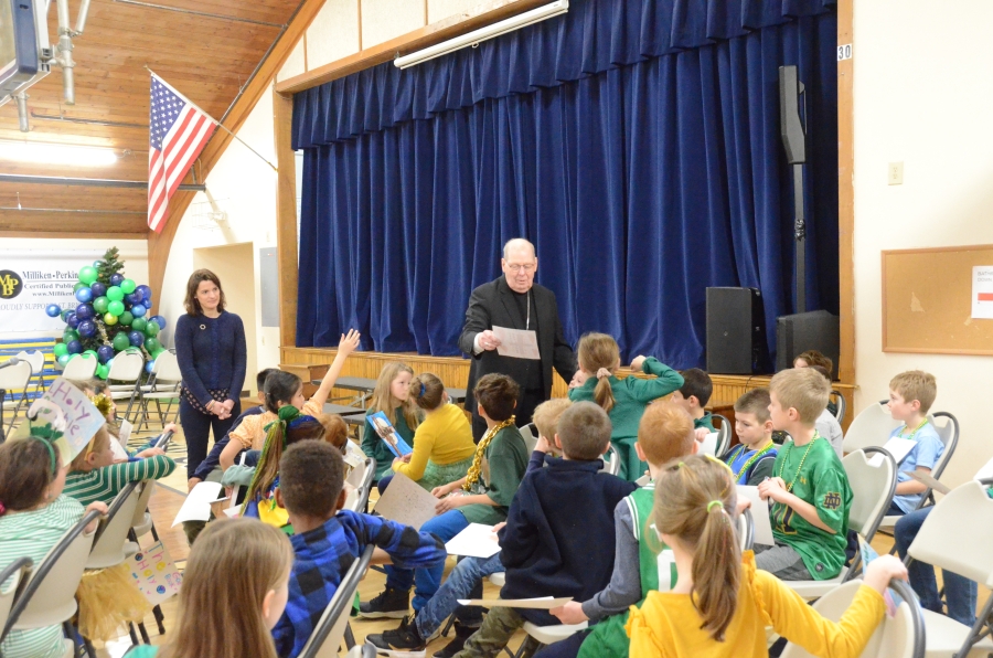 Bishop reads to students