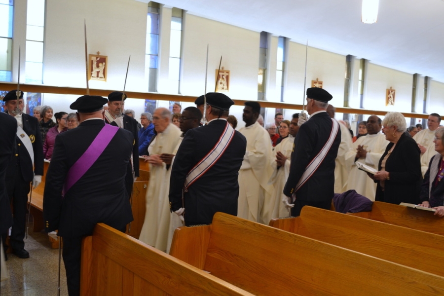 Knights of Columbus line the center aisle for the opening procession.