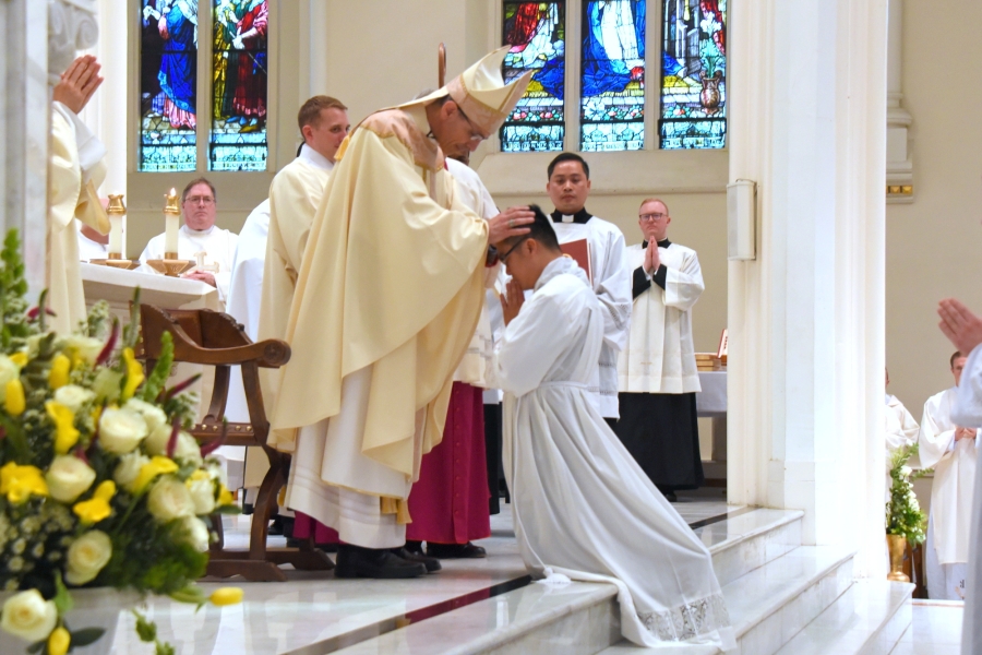 Bishop Ruggieri lays hands on Thanh Duc Pham