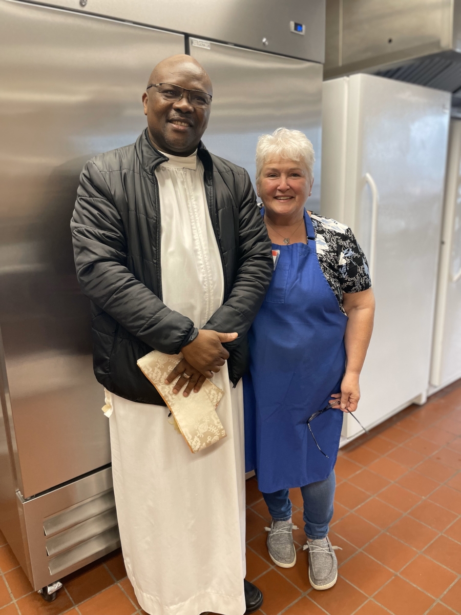 Pastor of Corpus Christi Parish Fr. Patrick Agbodi and Director of the St. John the Baptist Food Pantry Anne Hodgdon