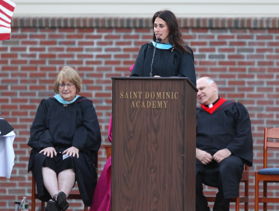 Principal speaking at graduation 