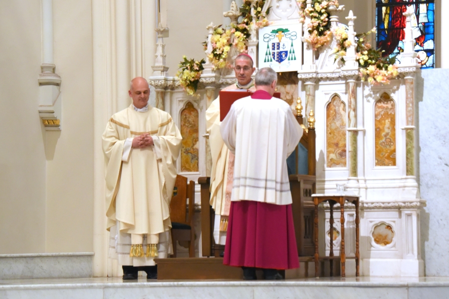 Bishop Ruggieri shares the opening prayer. Father Seamus Griesbach and Msgr. Marc Caron are also pictured.