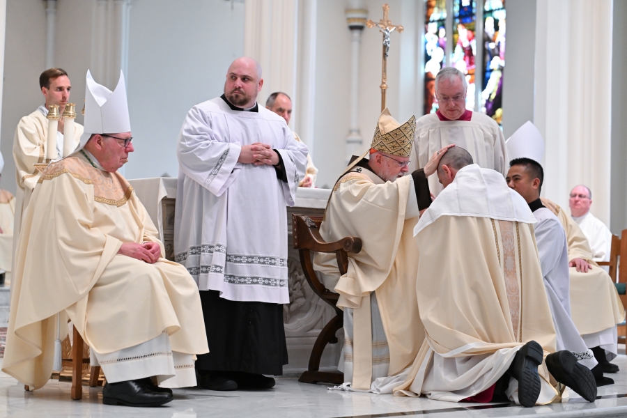 Cardinal O'Malley anoints Bishop Ruggieri's head.
