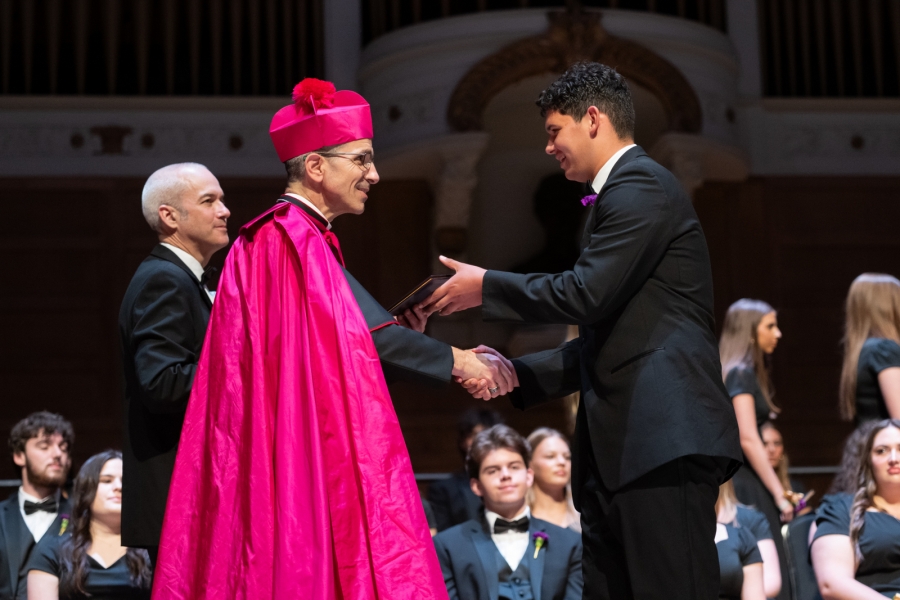 Bishop Ruggieri handing out diplomas