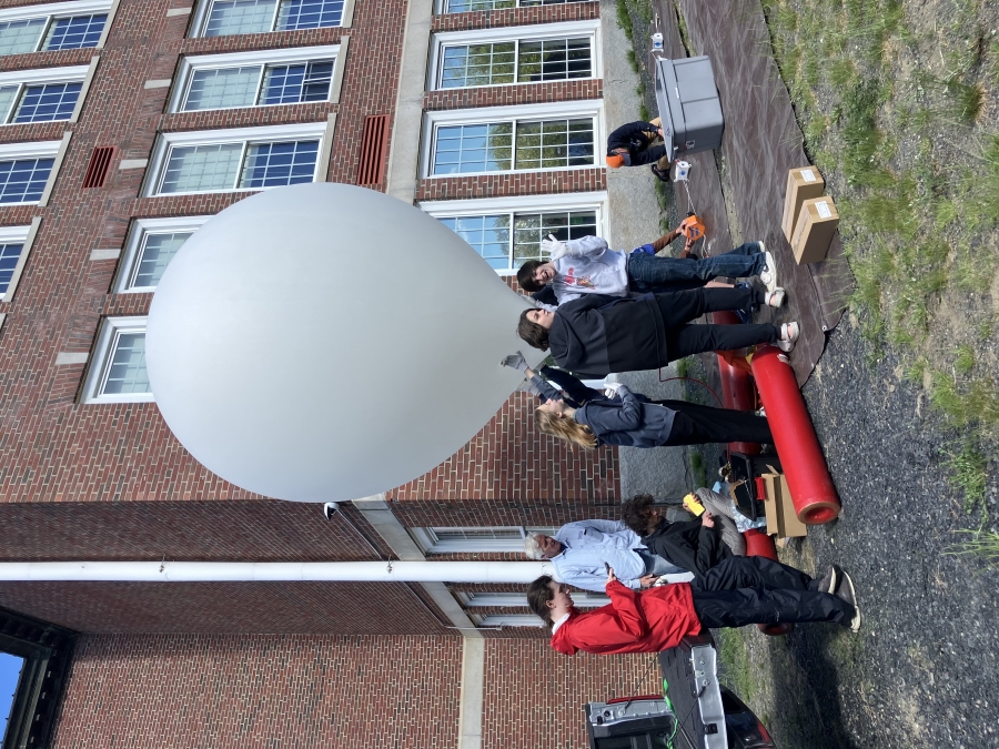 students on cubesat launch outside 