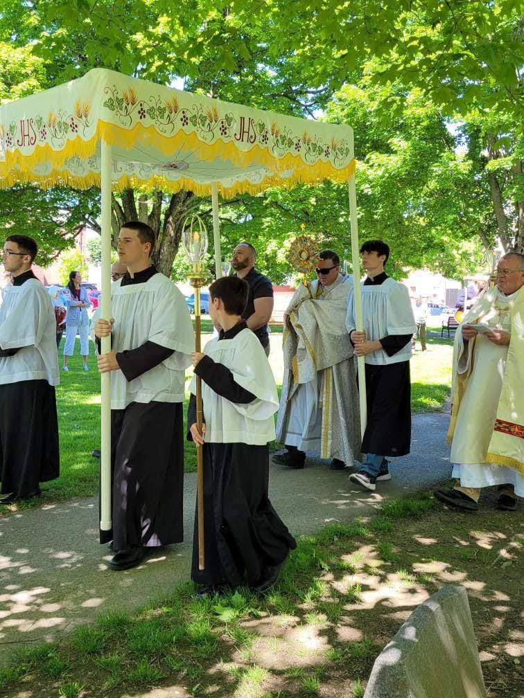 people walking in the Feast of Corpus Christi Procession