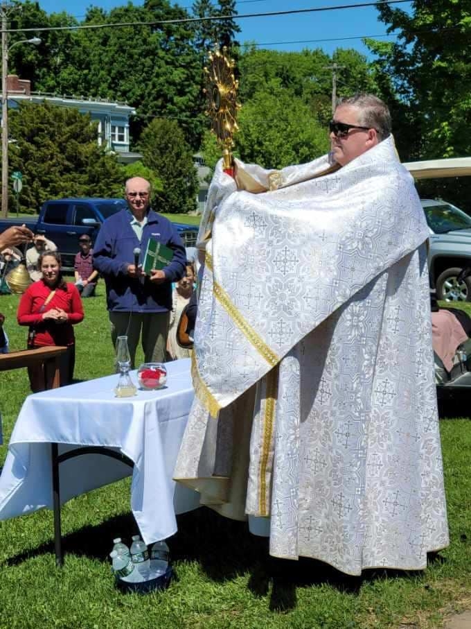 praying in the Corpus Christi Procession