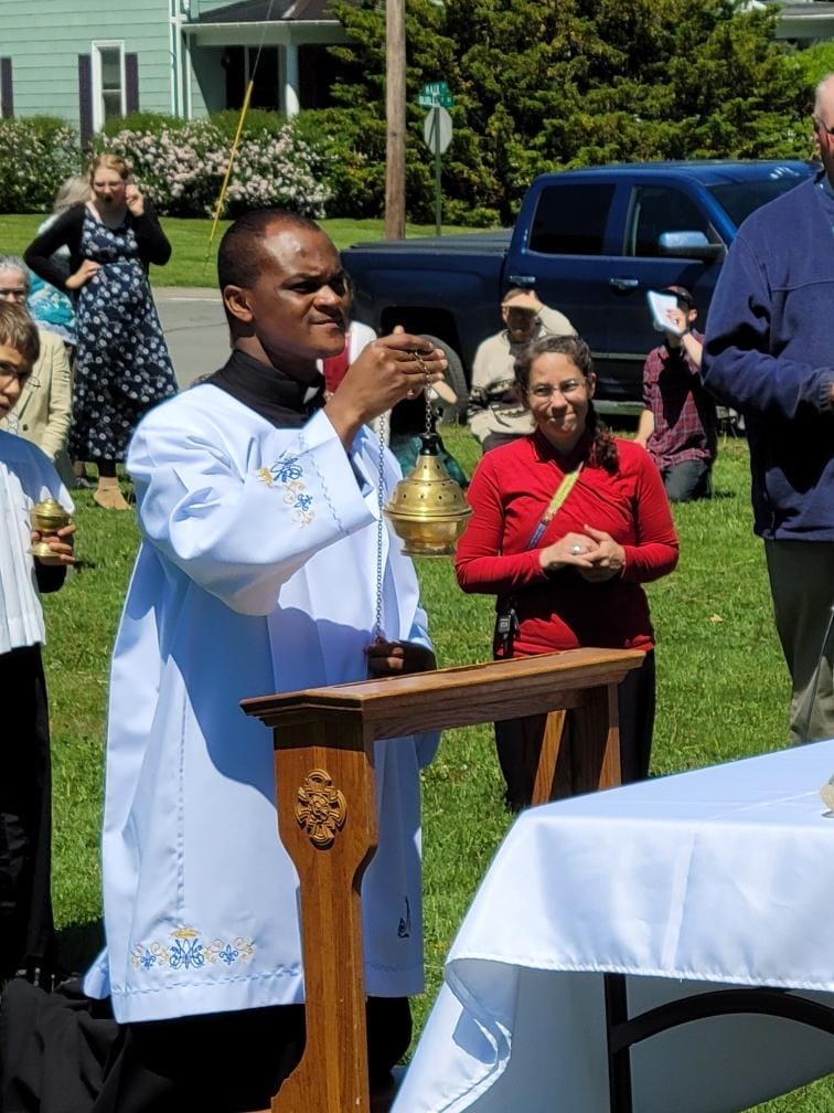 praying in the Corpus Christi Procession