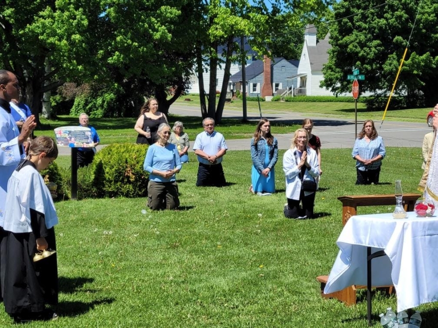 praying in the Corpus Christi Procession