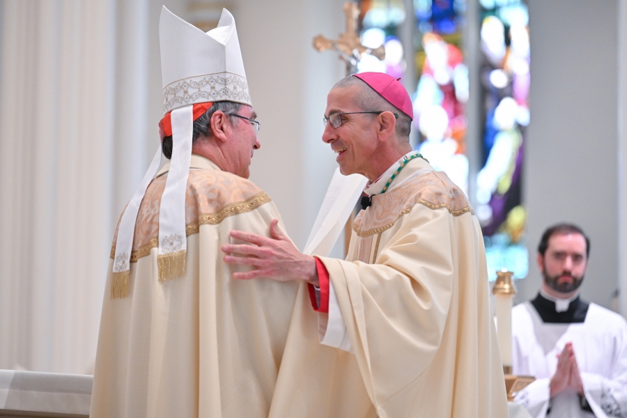 Bishop Ruggieri greets the apostolic nuncio, Cardinal Pierre.