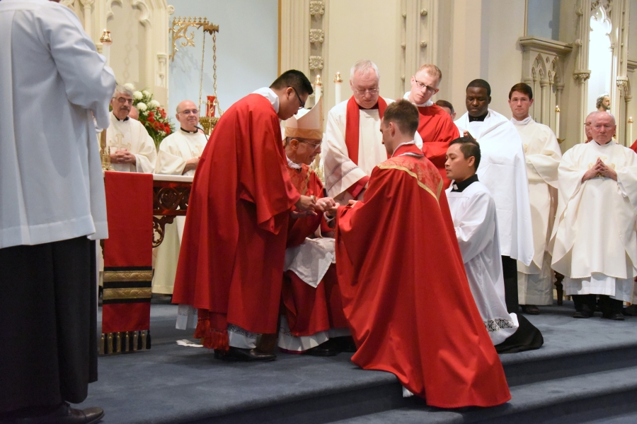 Bishop Ruggieri anoints Father Valles' hands.