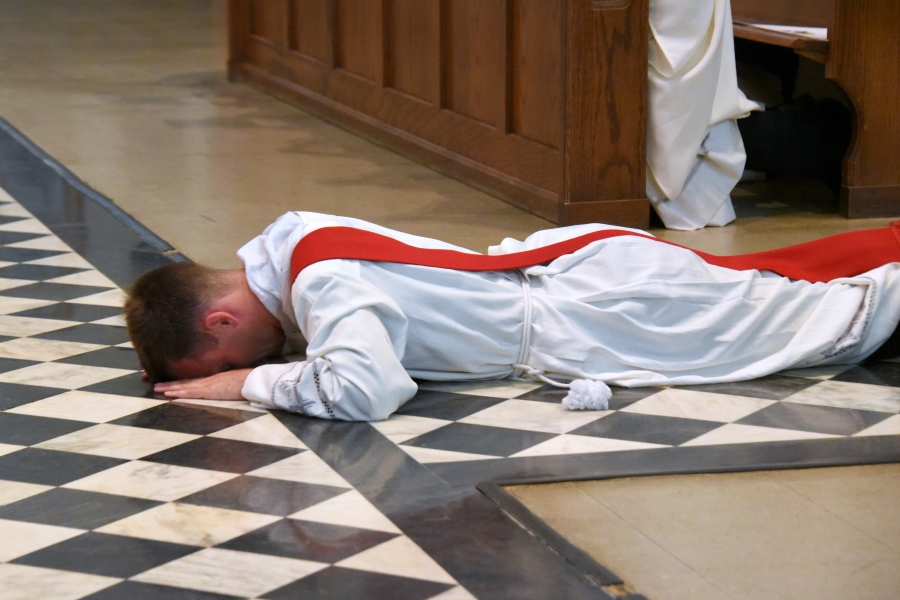 Deacon Matthew Valles lies prostrate.