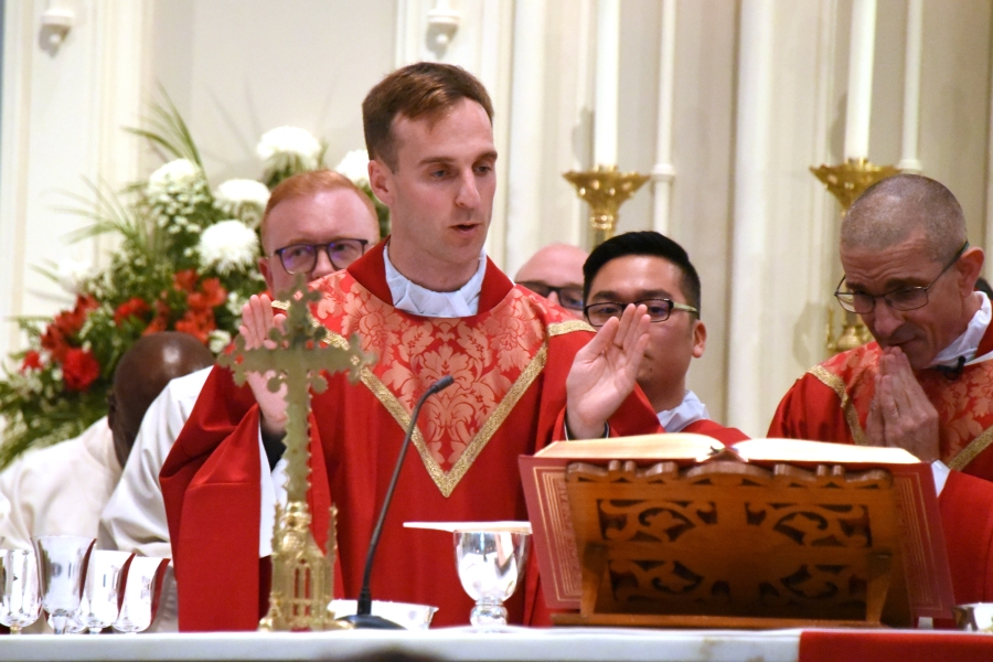 Father Matthew Valles joins in the Liturgy of the Eucharist.